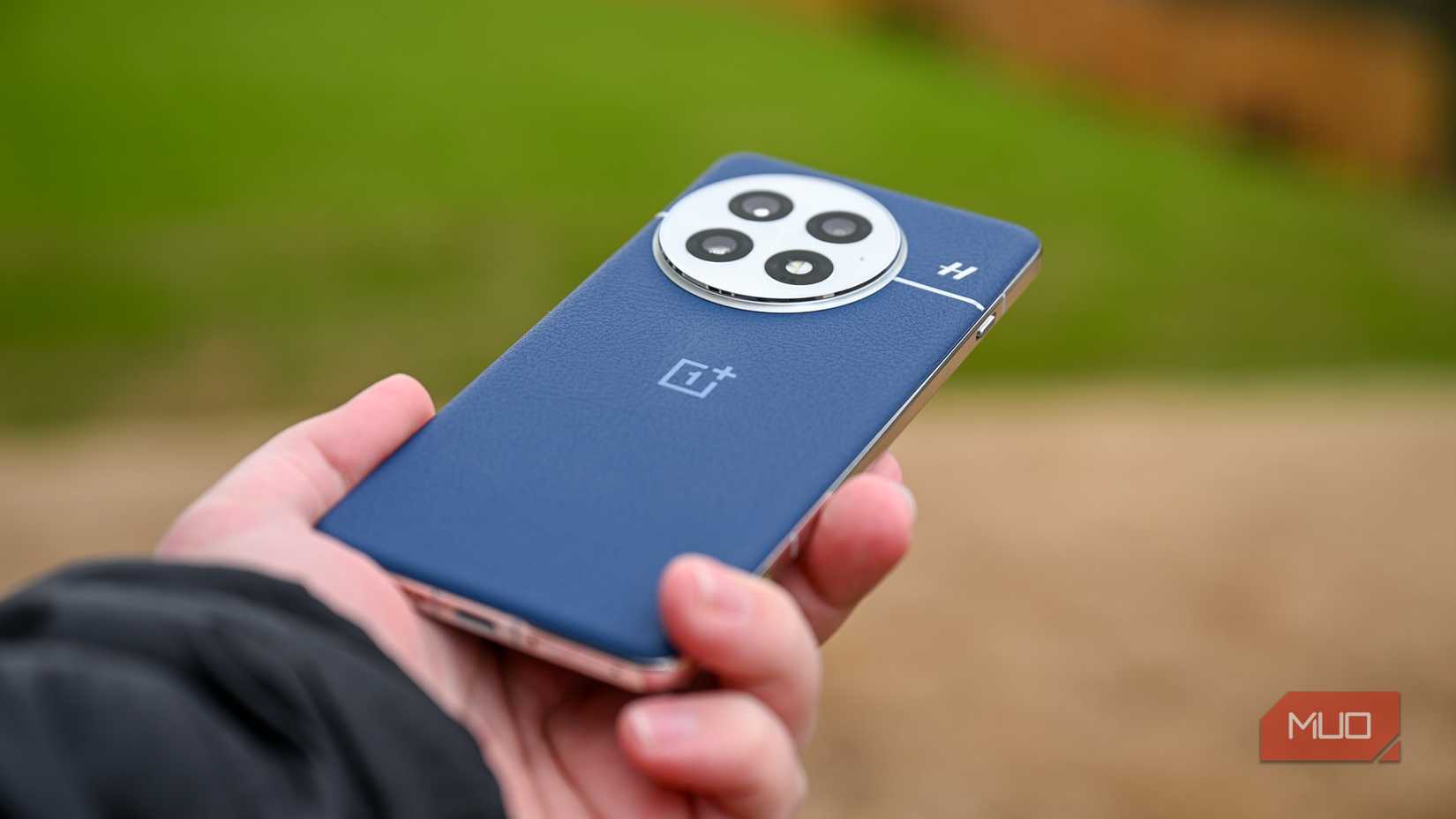 Person holding the OnePlus 13 at an angle