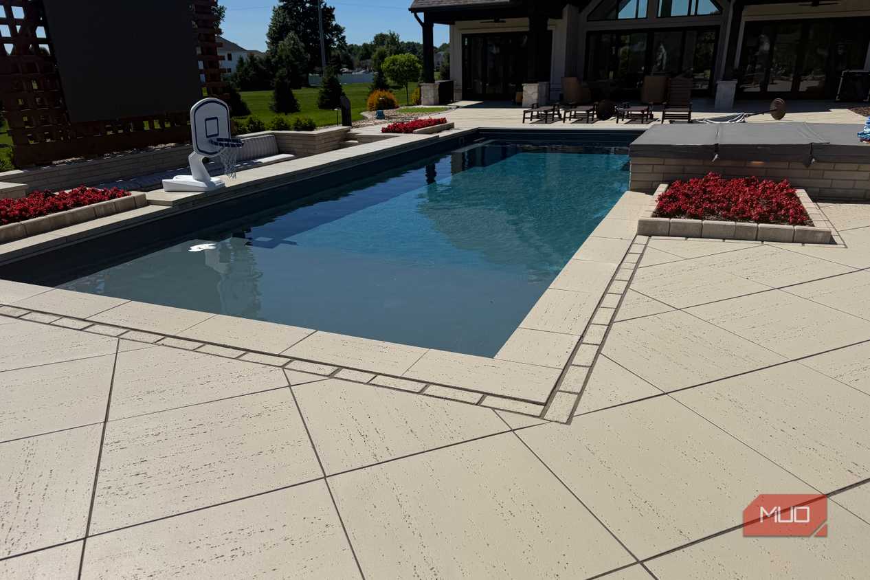 pool corner with red flower planter