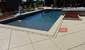 pool corner with red flower planter