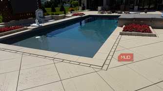pool corner with red flower planter