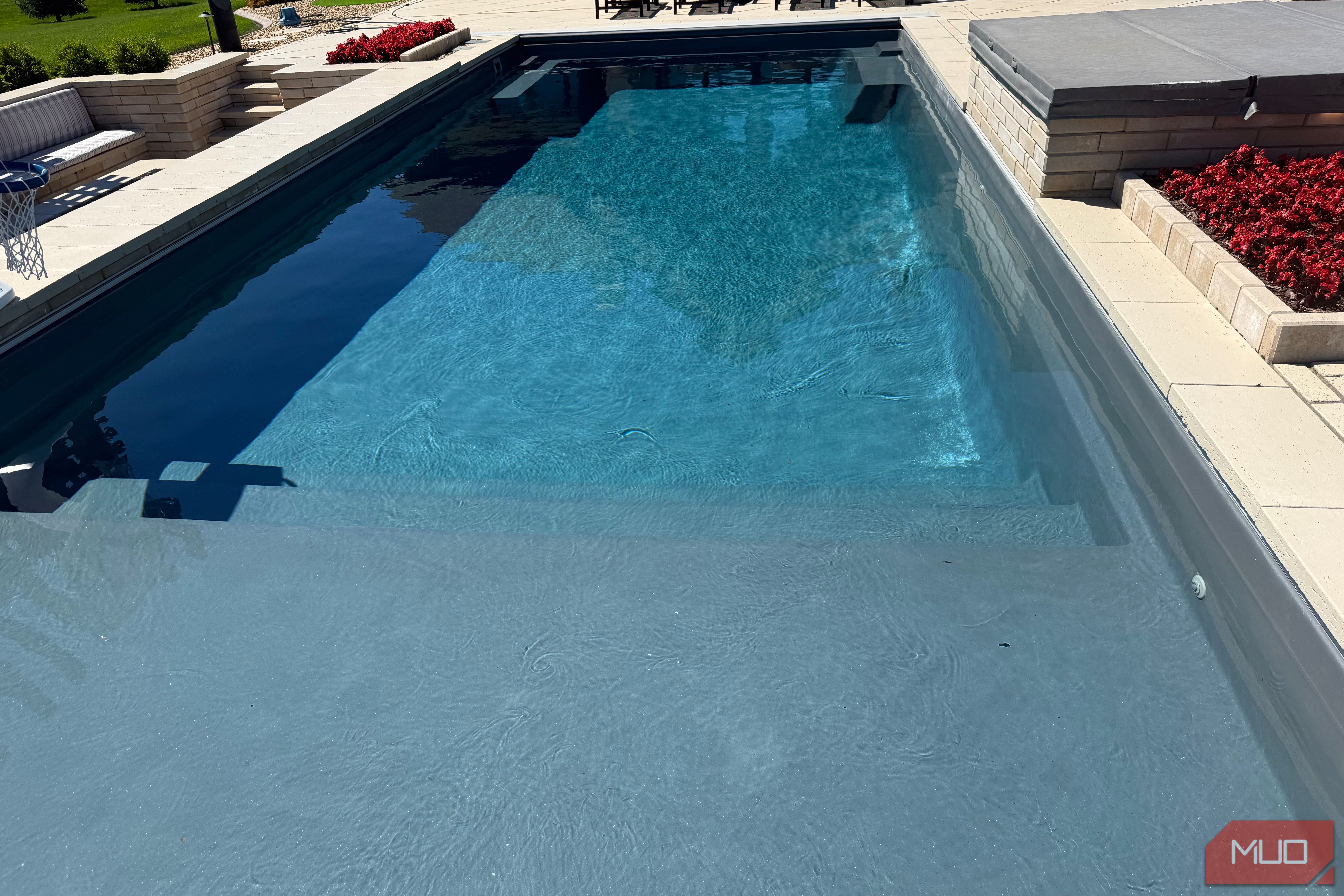 pool with sun shelf and spa