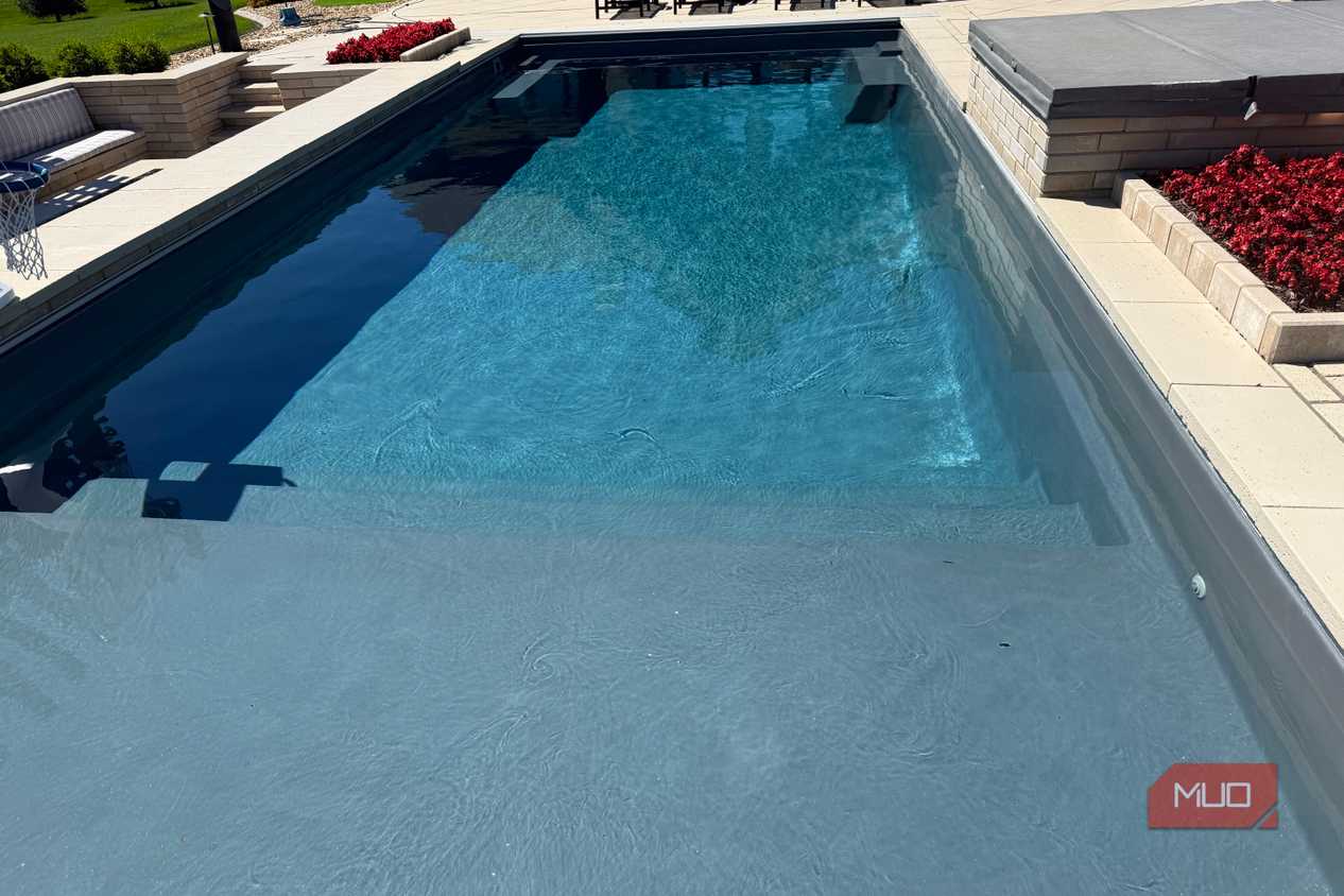 pool with sun shelf and spa