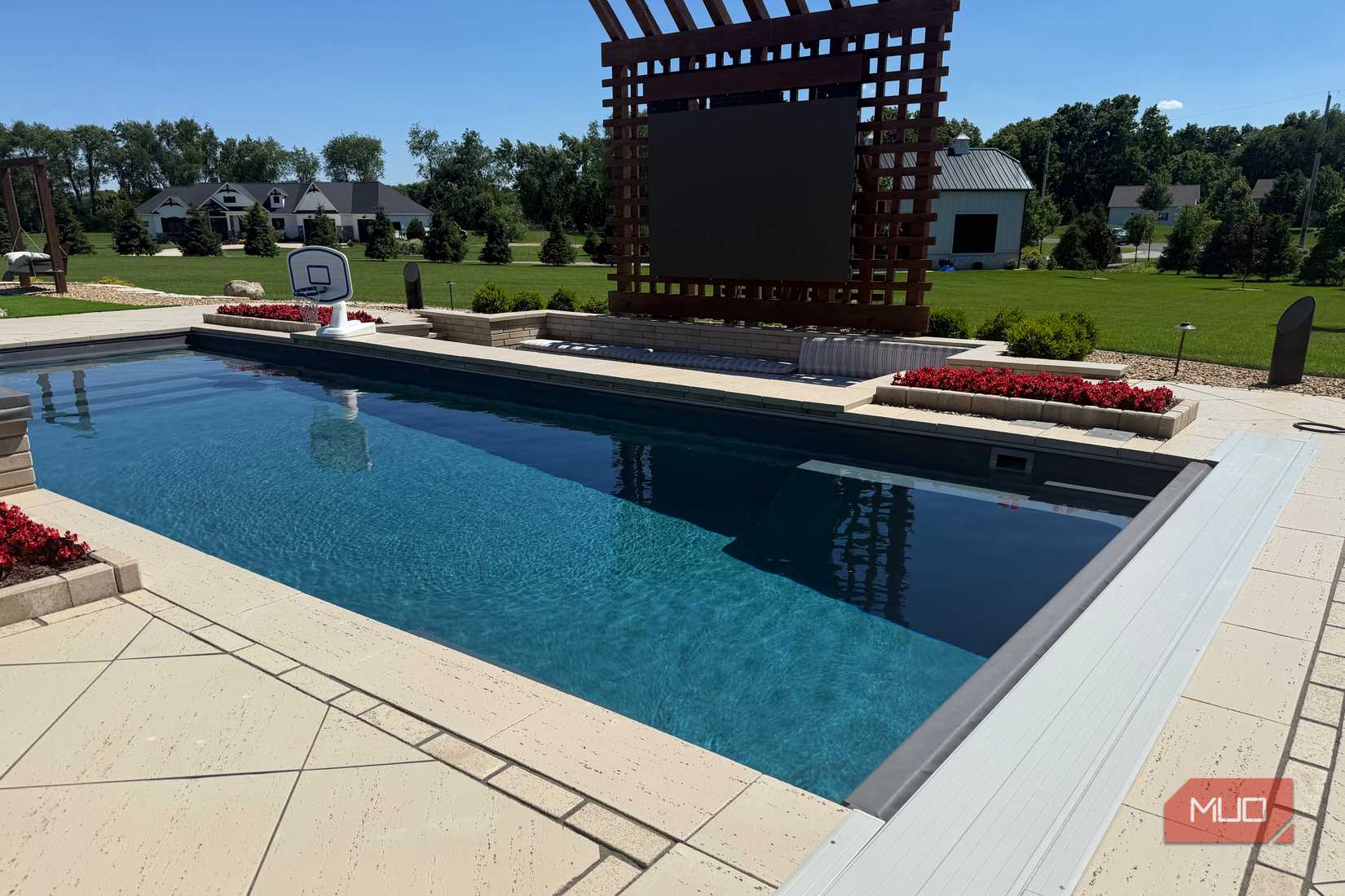 rectangular pool with pergola and cover open