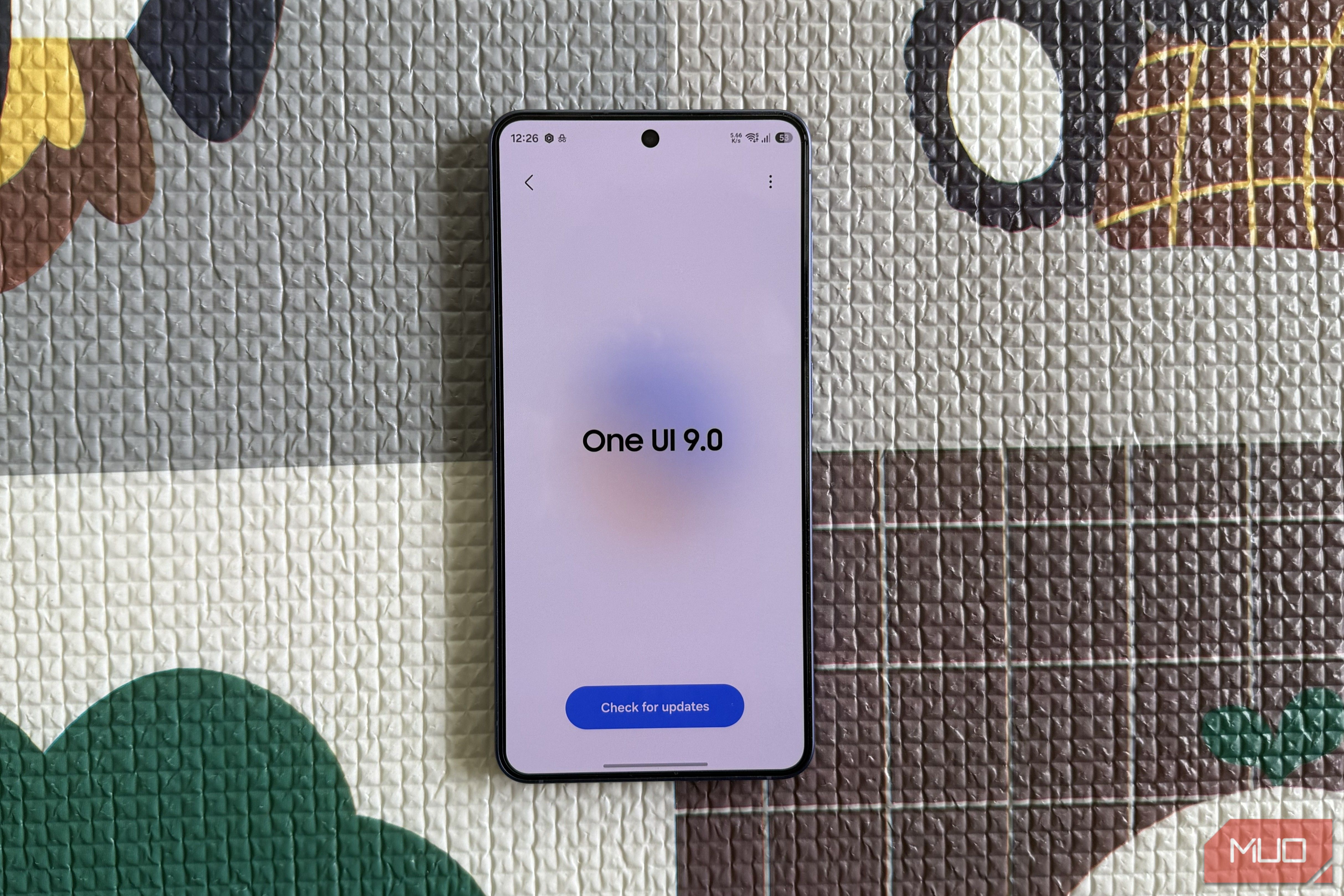 S26 phone showing One UI 9 update screen
