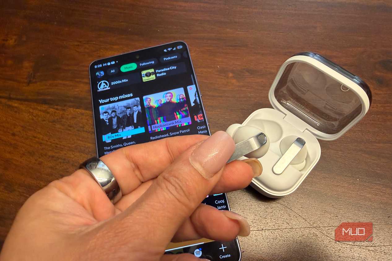The Samsung Galaxy Buds4 pro with the Samsung Galaxy S26 Ultra showing Spotify.