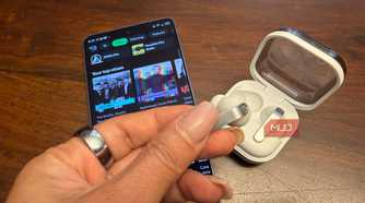 The Samsung Galaxy Buds4 pro with the Samsung Galaxy S26 Ultra showing Spotify.