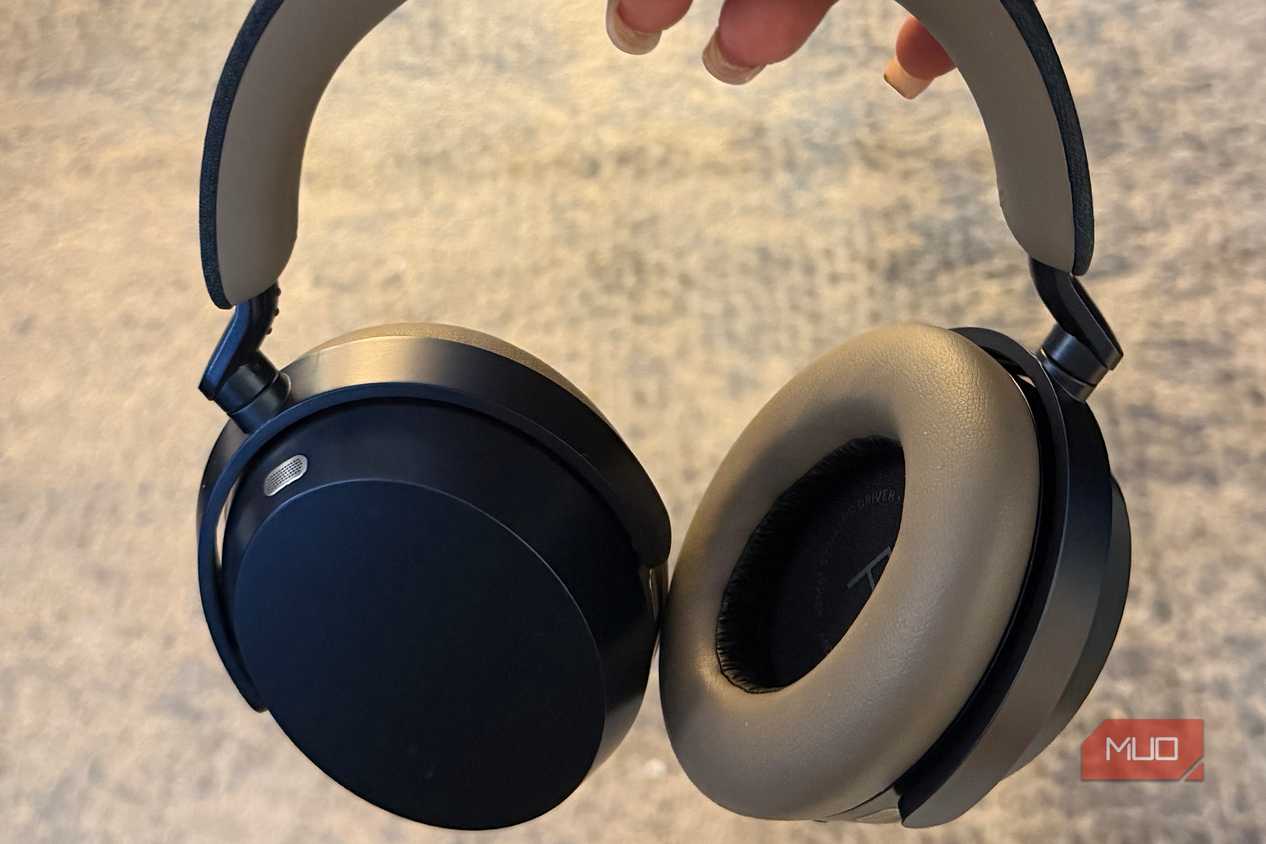 The Sennheisr Momentum 5 headphones held in hand.