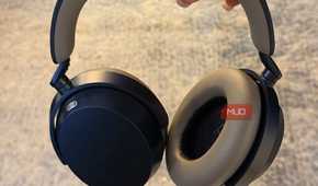 The Sennheisr Momentum 5 headphones held in hand.