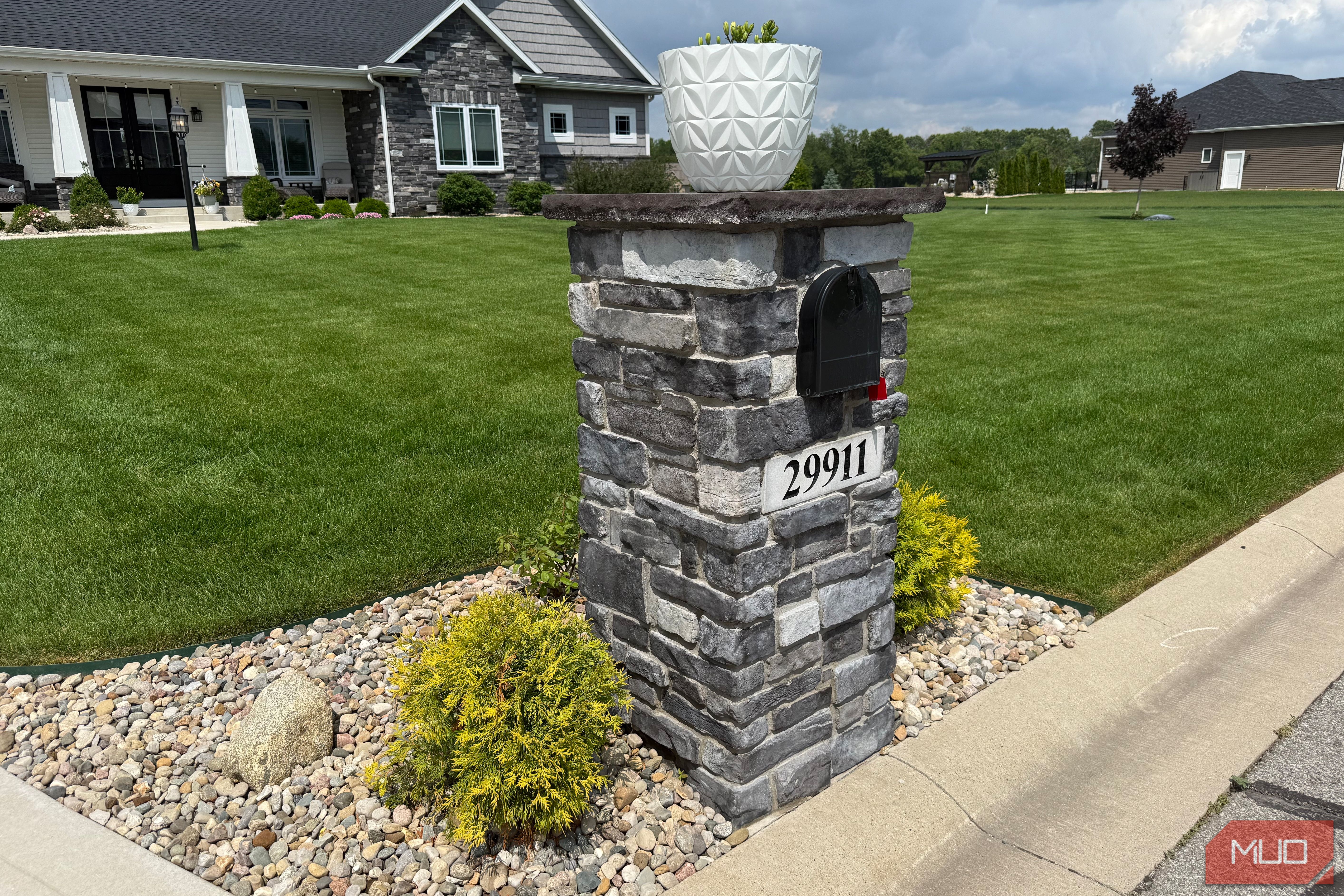 Stone mailbox pillar with house number 29911