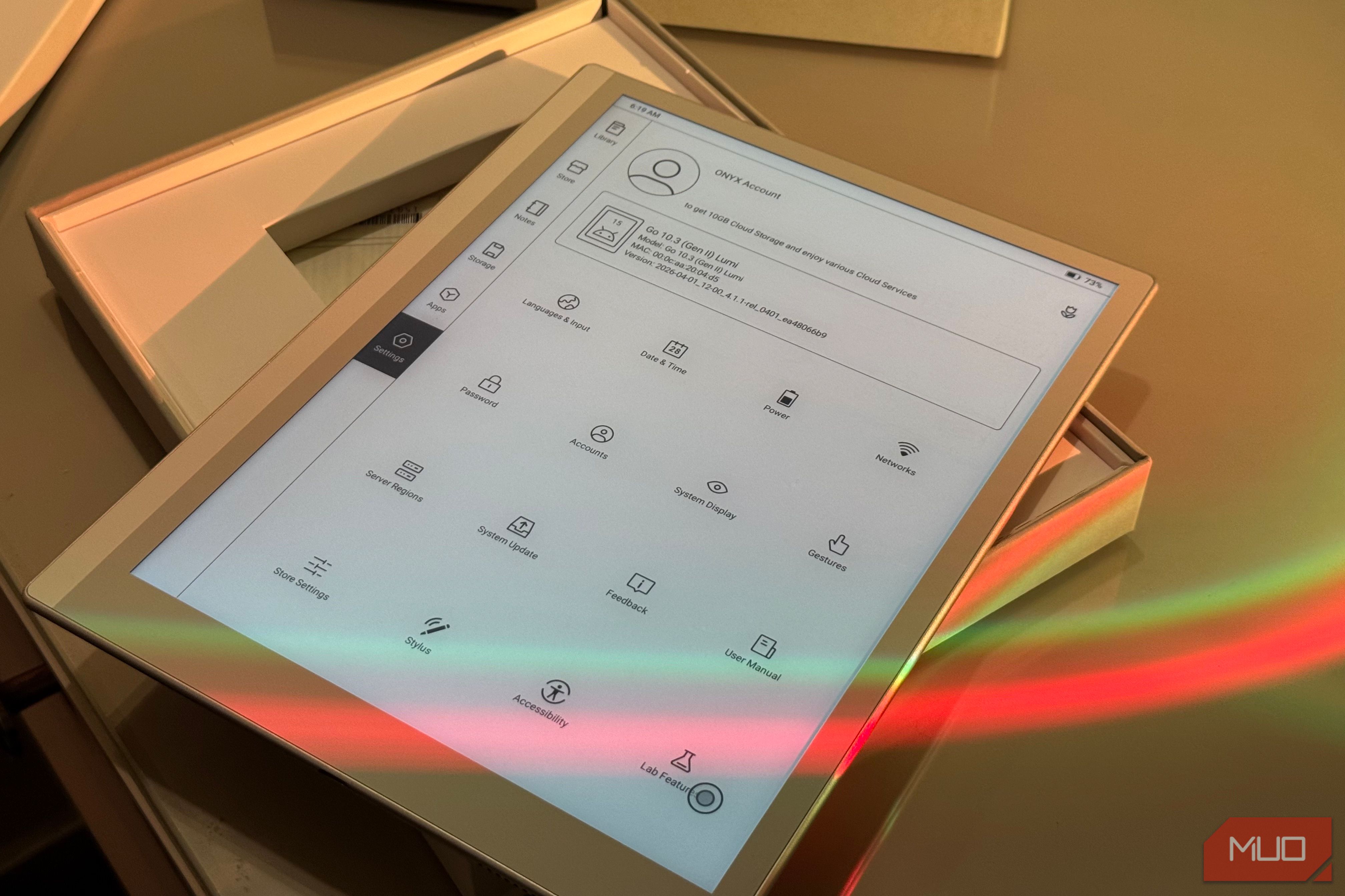 tablet device displaying app menu with various icons and options in wooden holder with colored light reflection