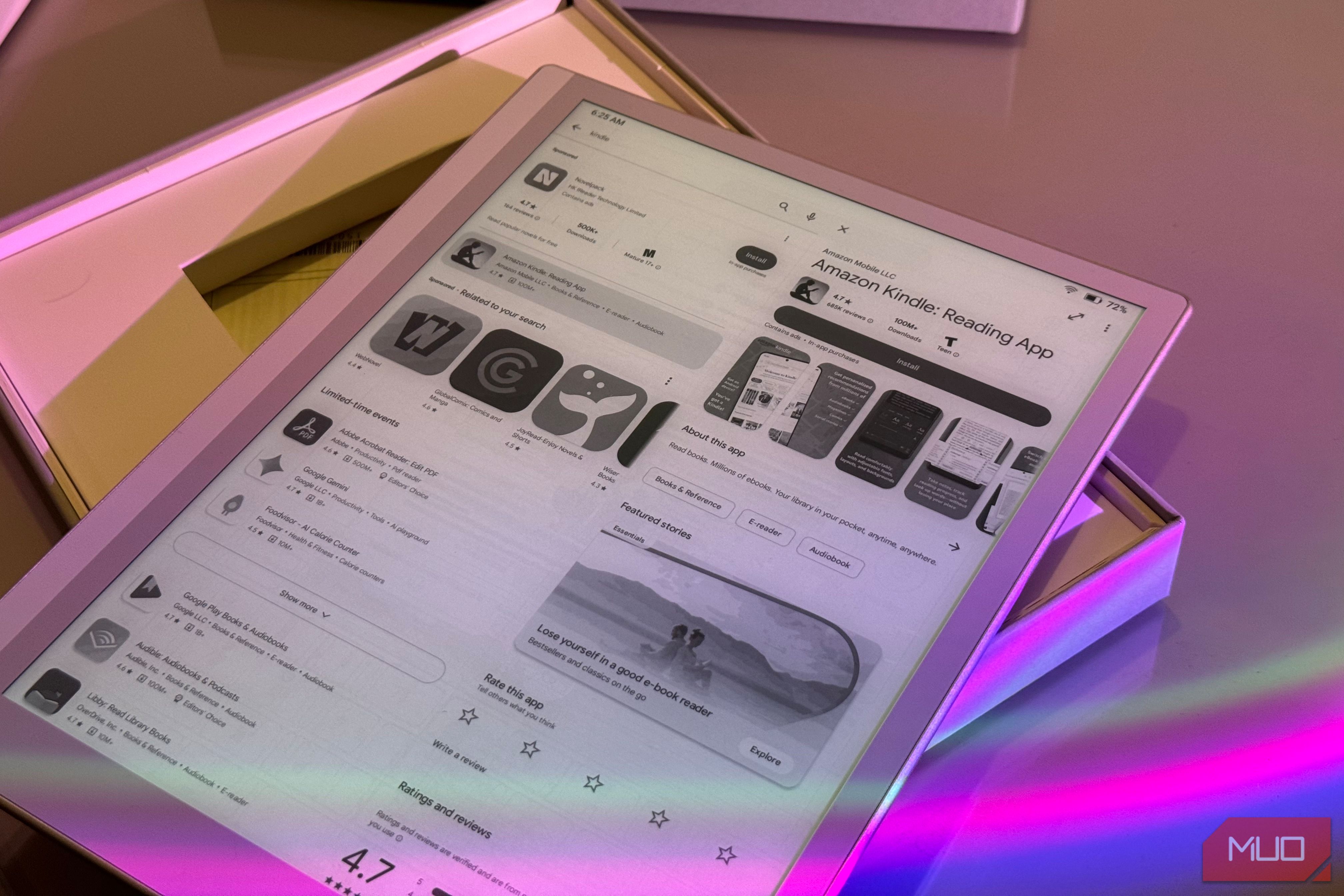 tablet display showing amazon kindle reading app with colorful pink and purple ambient lighting