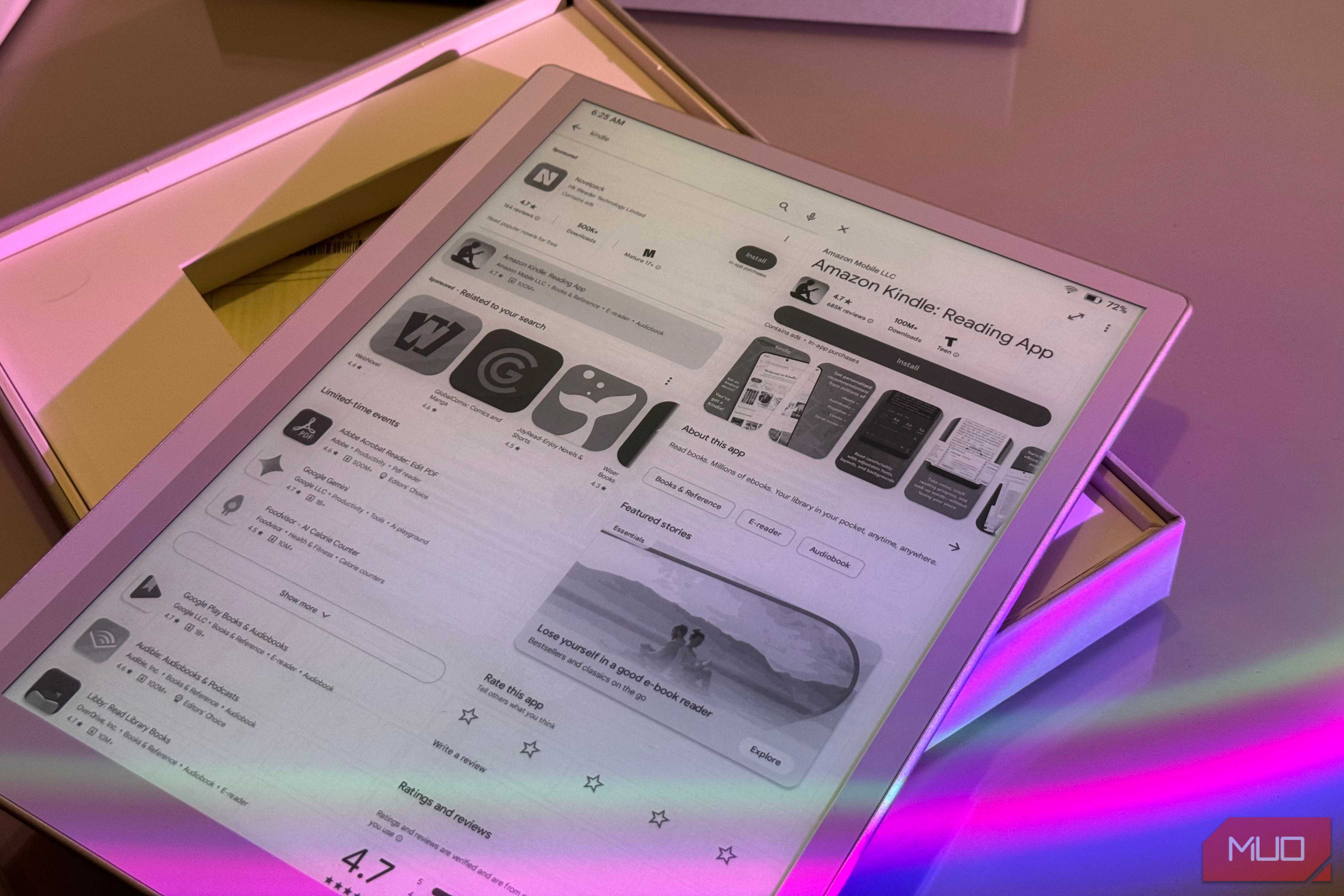 tablet display showing amazon kindle reading app with colorful pink and purple ambient lighting