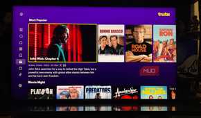 The Tubi app on a TV showing popular movies.