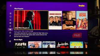 The Tubi app on a TV showing popular movies.