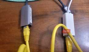 Two ethernet cables plugged into two adapters