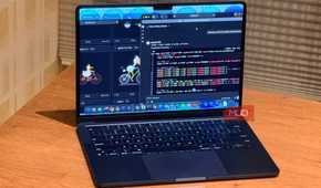 A laptop on a desk showing a local LLM running the pelican test