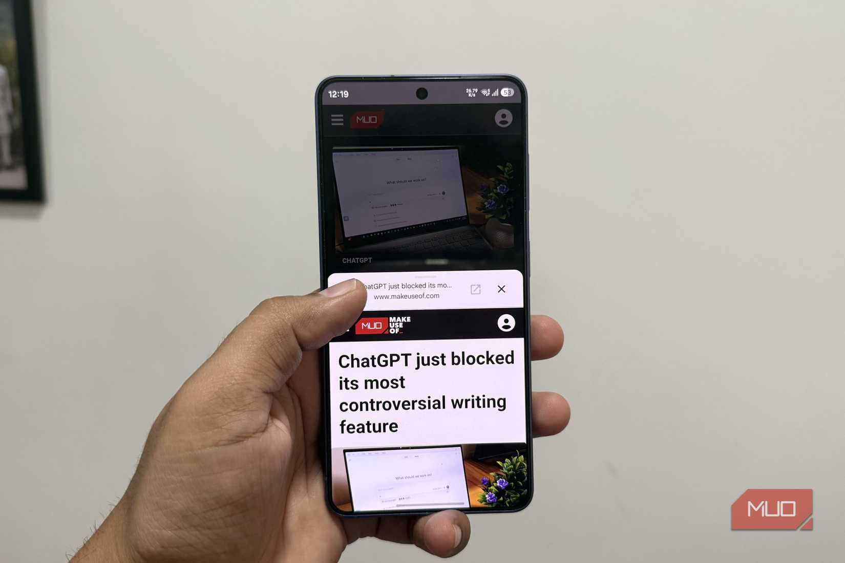 Android phone in hand showing Chrome preview feature