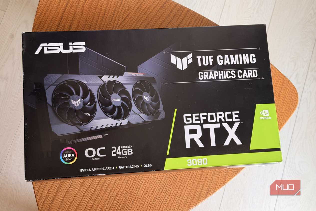 ASUS TUF Gaming GeForce RTX 3090 graphics card box on a round wooden table