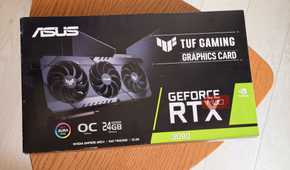 ASUS TUF Gaming GeForce RTX 3090 graphics card box on a round wooden table