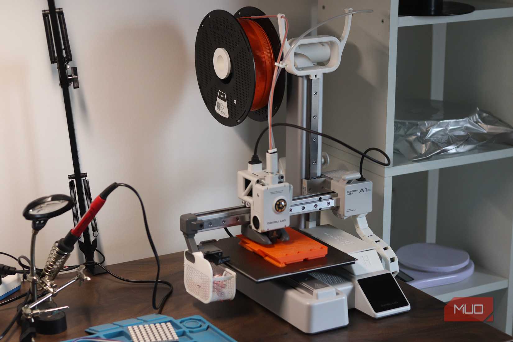 Bambu Lab A1 Mini sitting on a desk during a print.