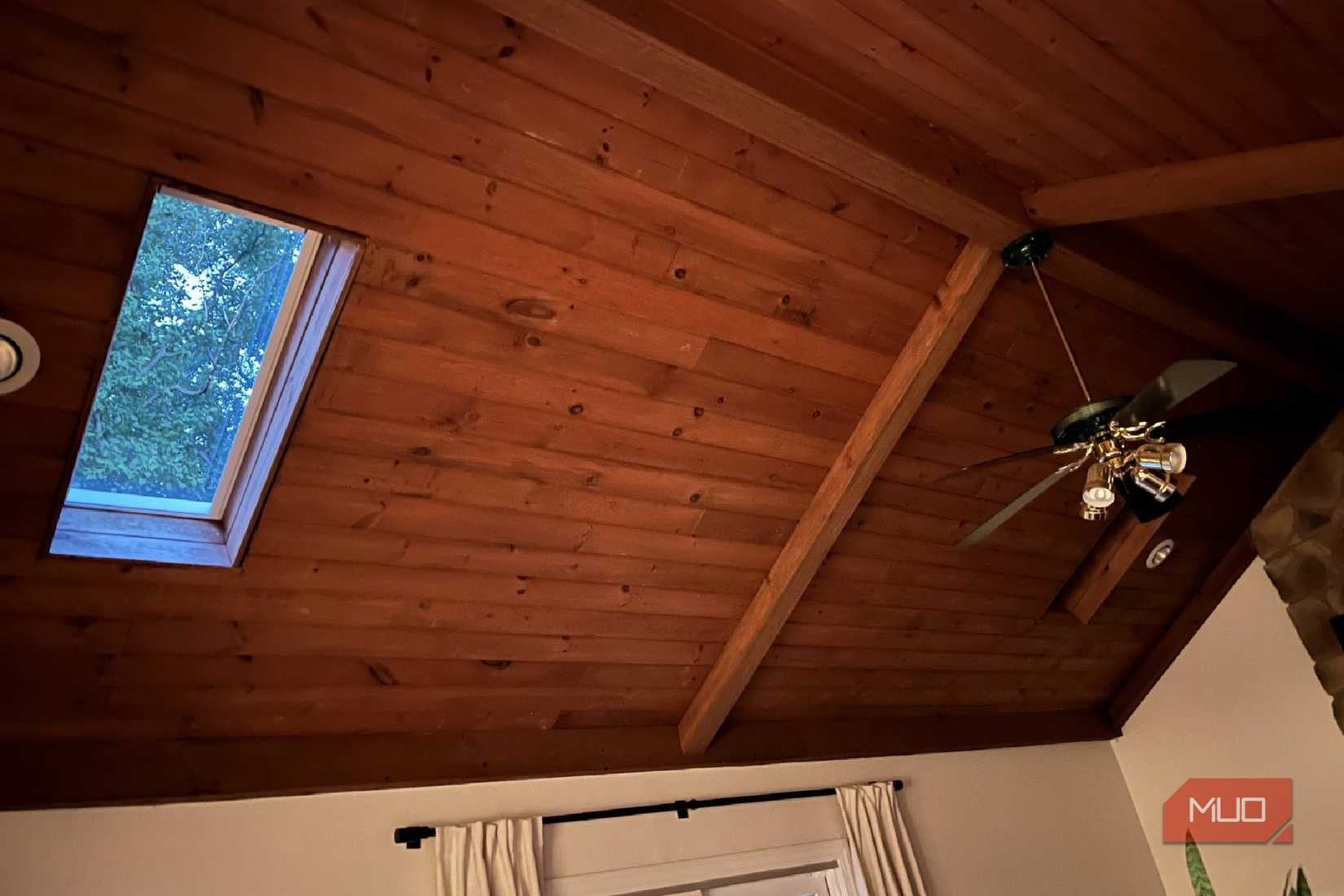 One skylight with blinds open and one with blinds closed.