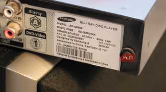 The model sticker of a thrifted Blu-ray player.