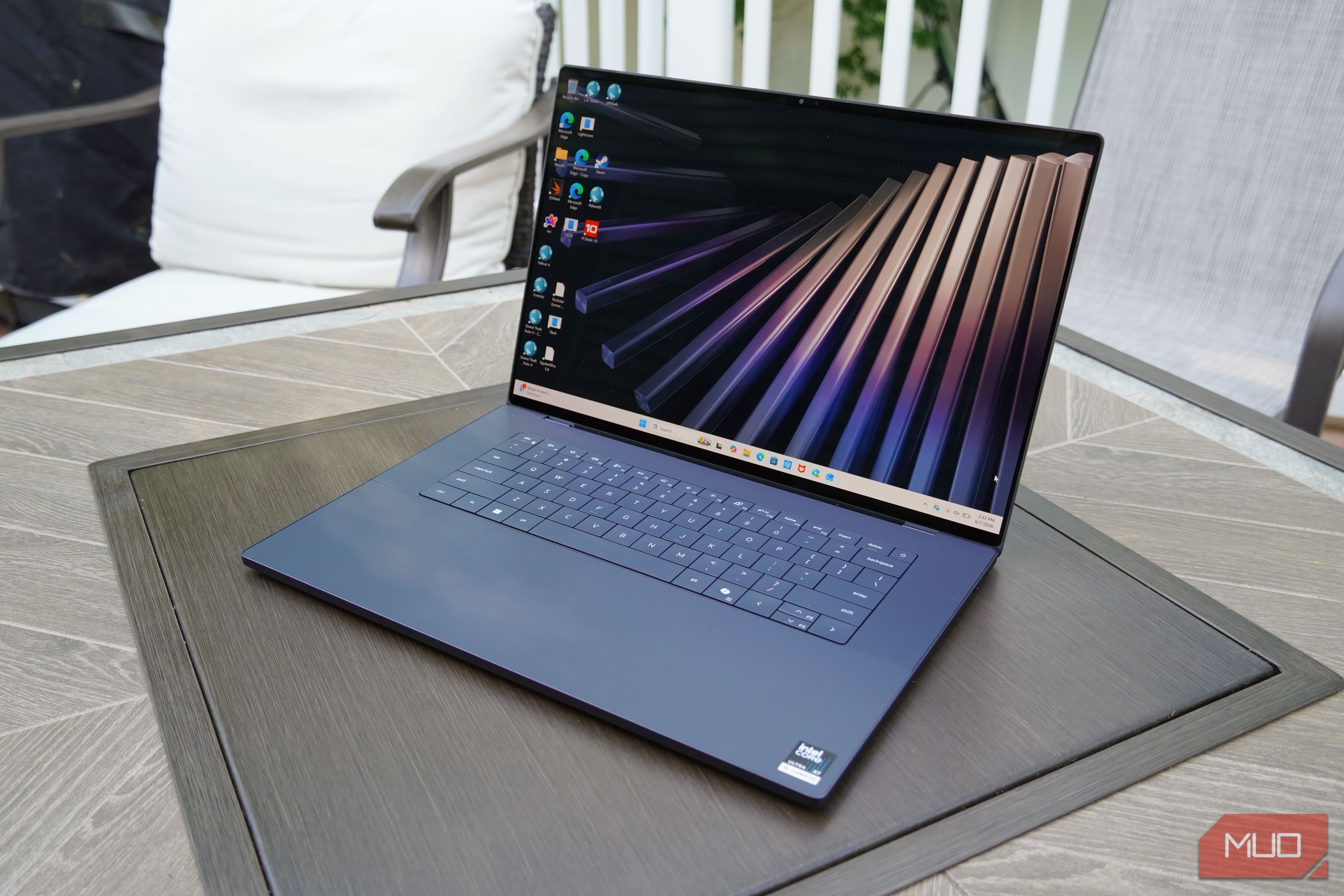 The XPS 16 display showing the Windows 11 home screen.