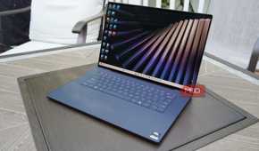 The XPS 16 display showing the Windows 11 home screen.