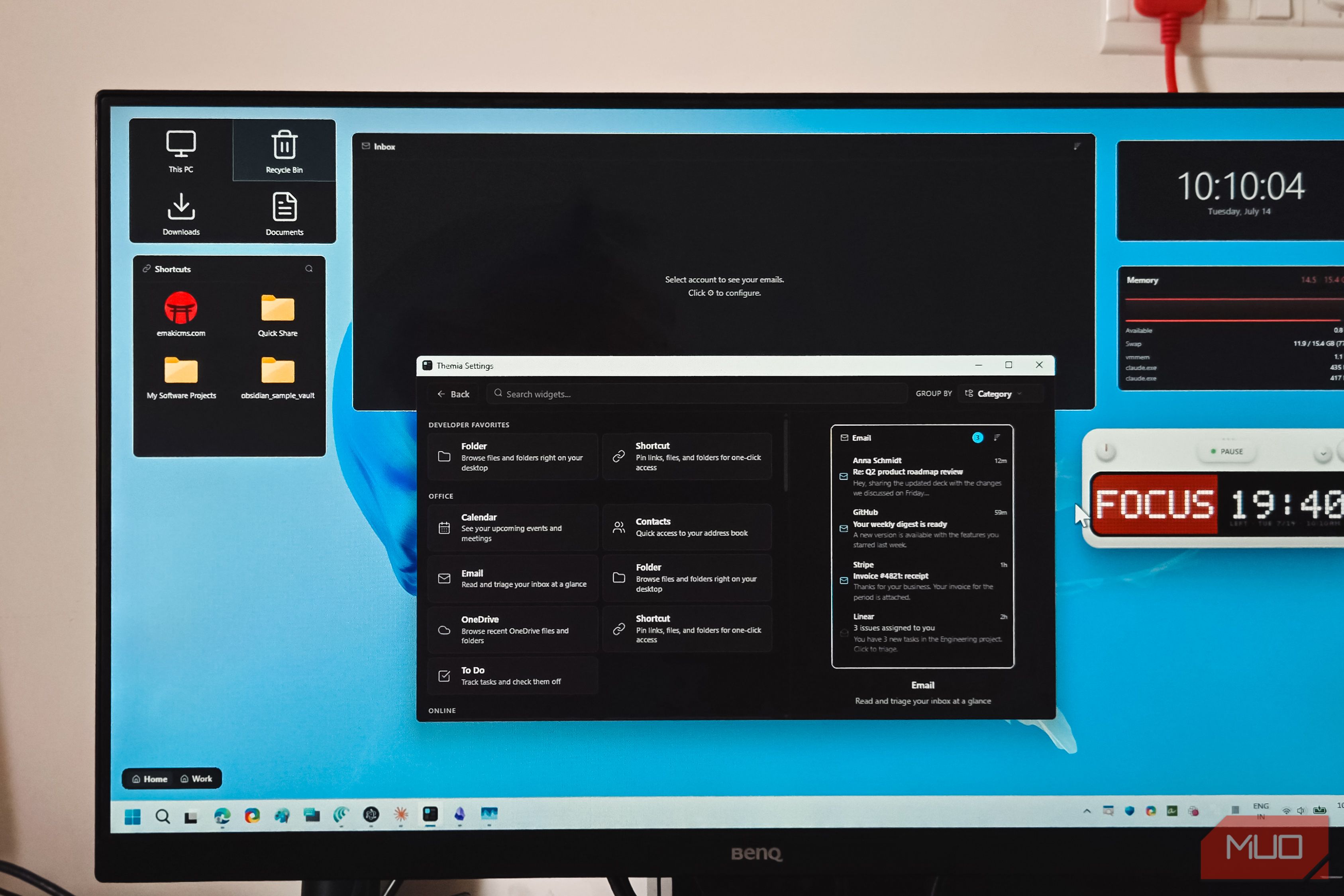 Desktop monitor photo Themia widget settings panel with email preview and folder shortcuts