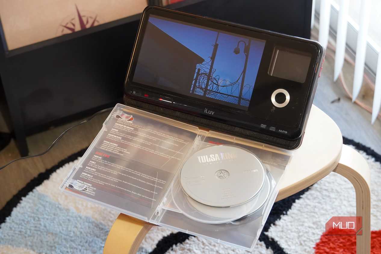 A DVD playing in front of a case.