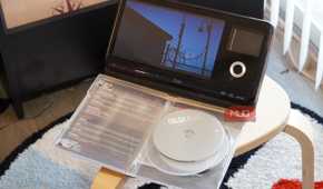 A DVD playing in front of a case.
