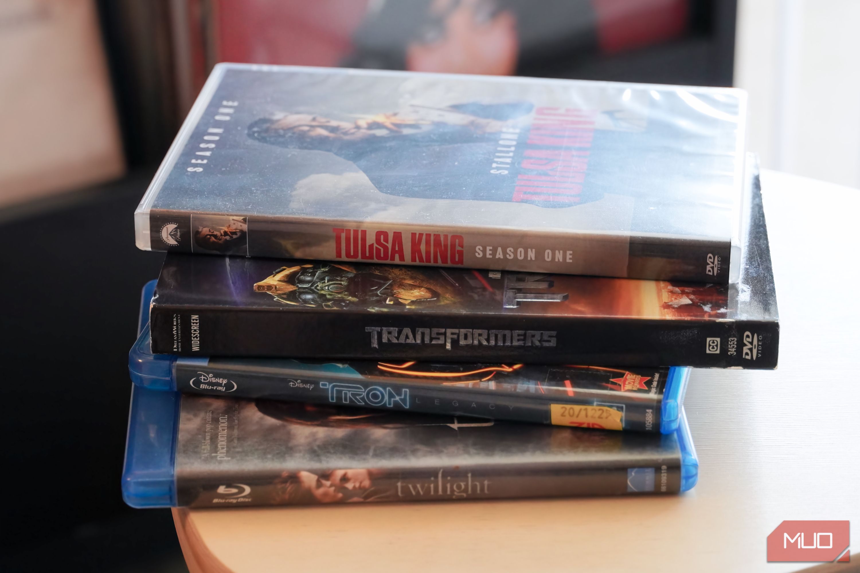 A stack of Blu-ray and DVD cases.