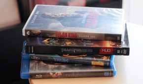 A stack of Blu-ray and DVD cases.