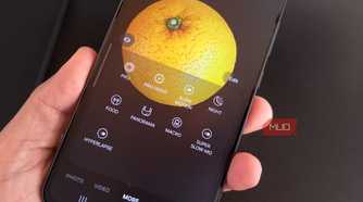 Galaxy phone showing Food mode while taking a pic of an orange