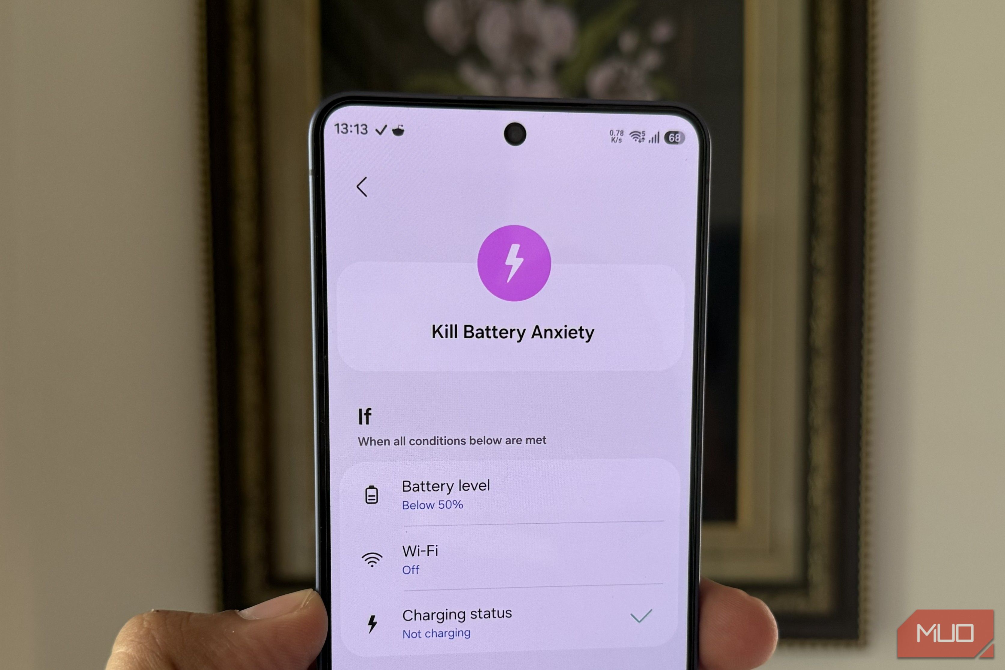Galaxy S26 in hand showing battery saving routine