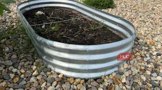 Galvanized Raised Garden Bed With Freshly Planted Soil-1