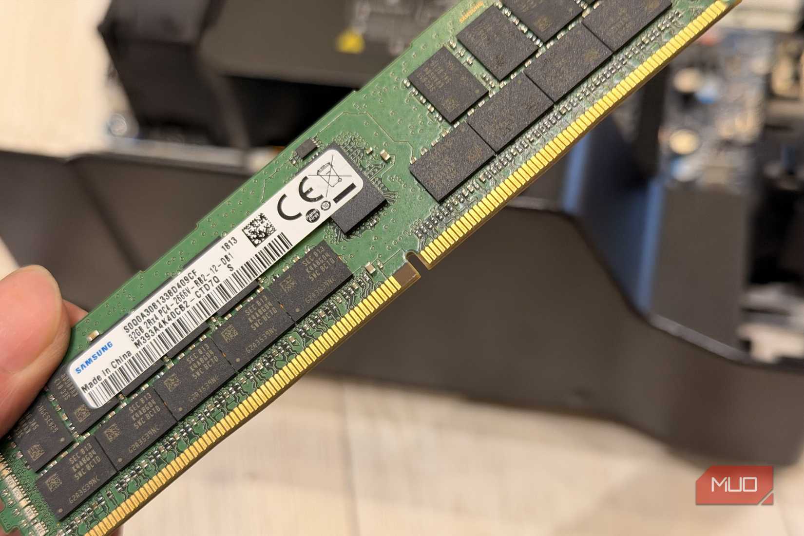 Hand holding a Samsung 32GB DDR4 registered ECC memory module