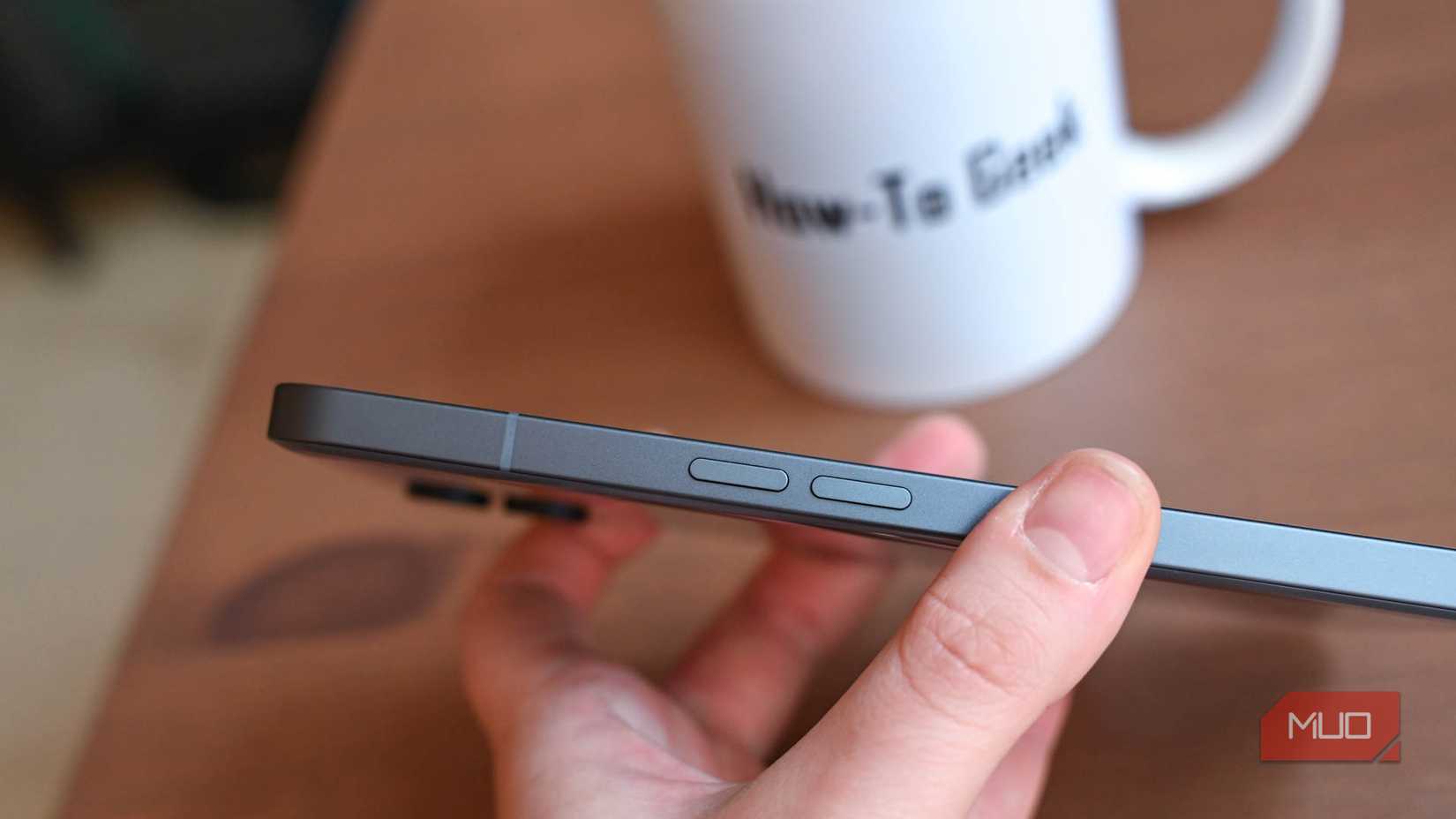 Hand Holding Smartphone Edge With Buttons Visible