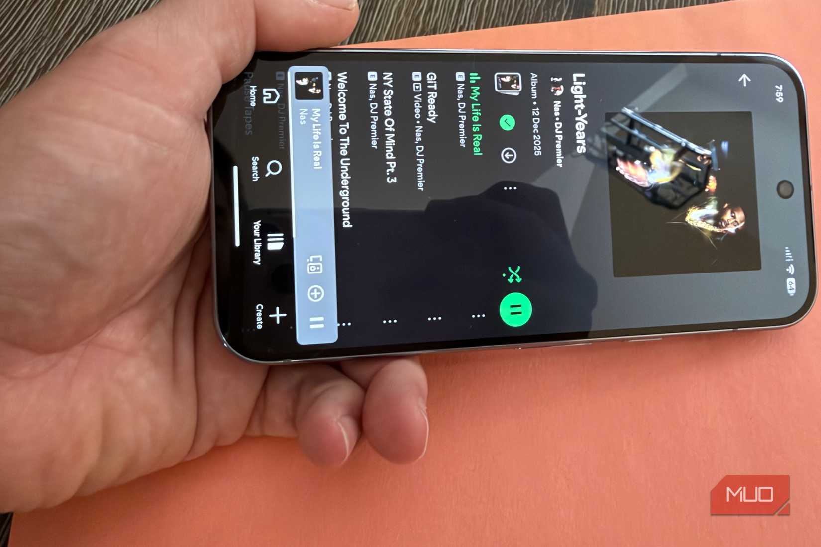 cupping hand around phone speaker