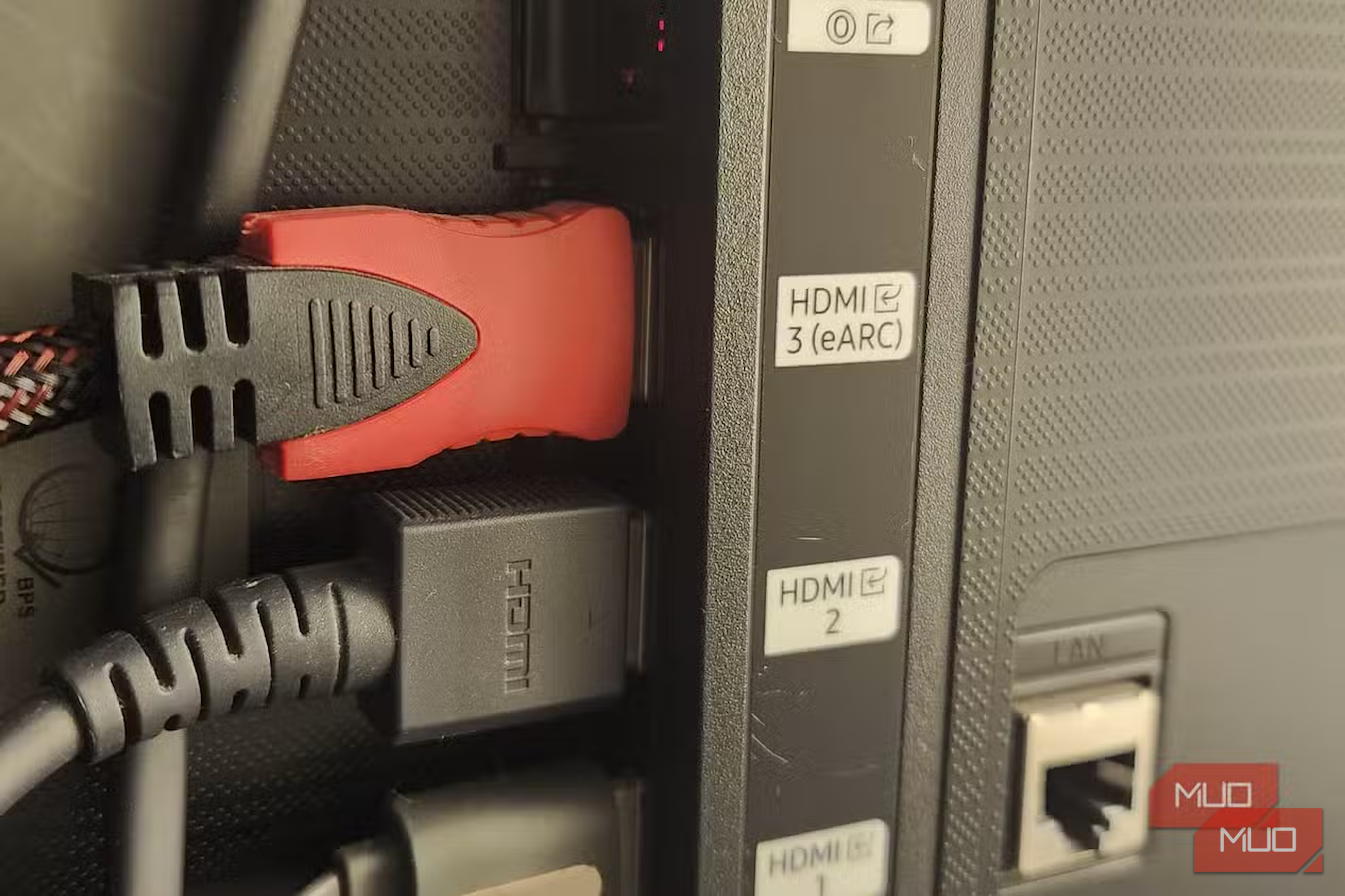 HDMI cables plugged into a television