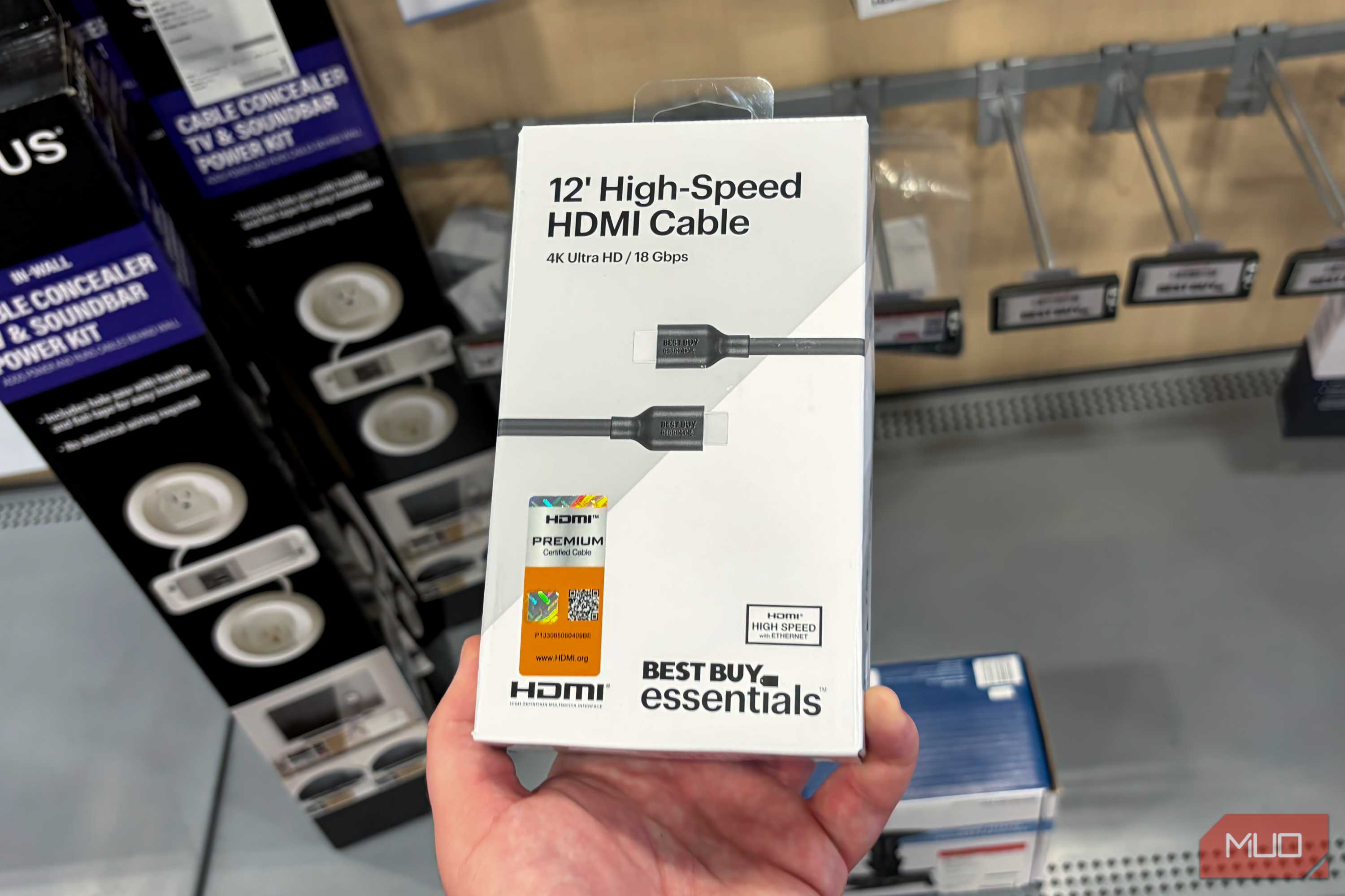 A high-speed HDMI cable with a certification badge attached.