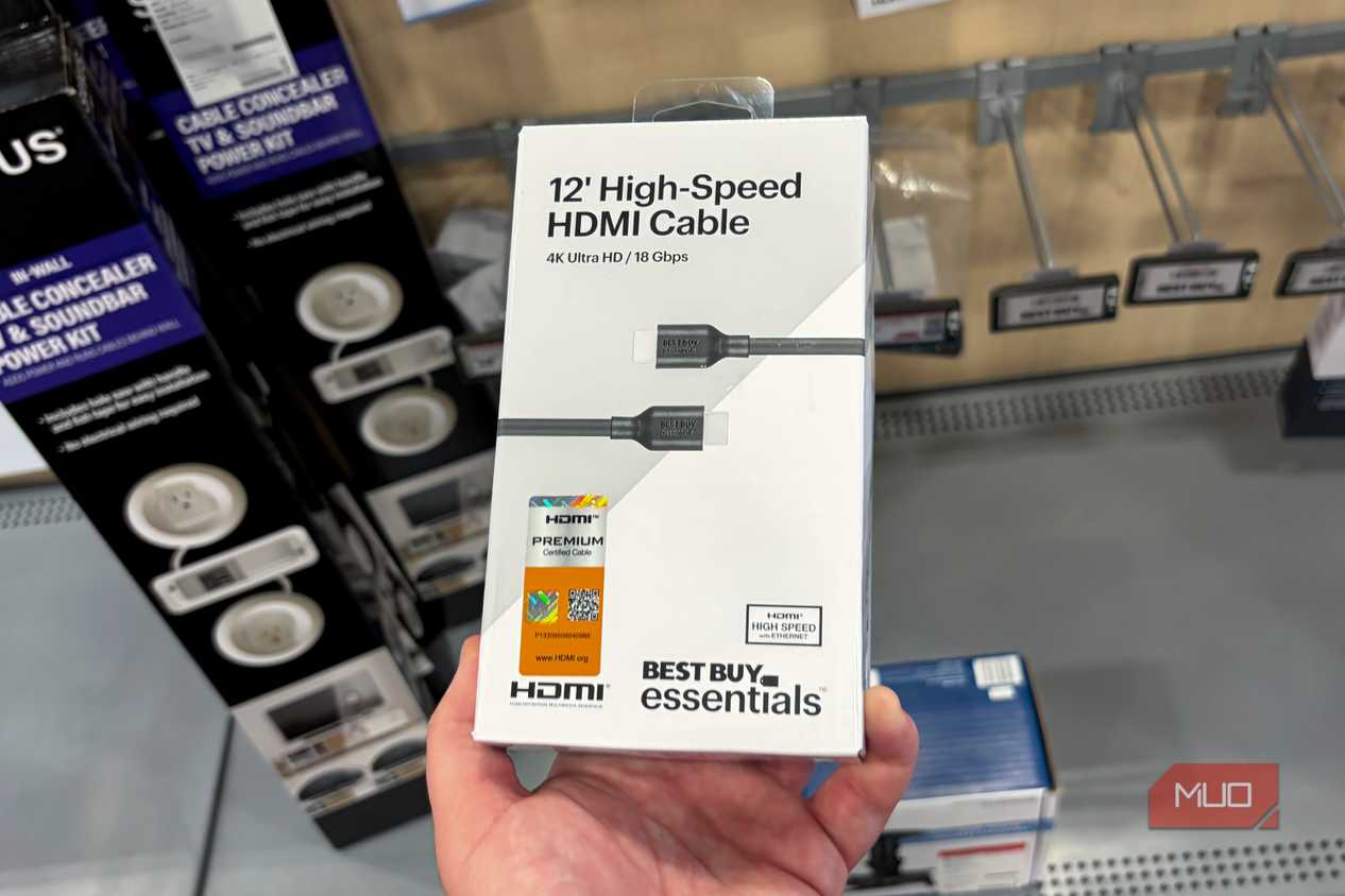A high-speed HDMI cable with a certification badge attached.