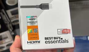 A close-up of the HDMI certification stickers on a box.