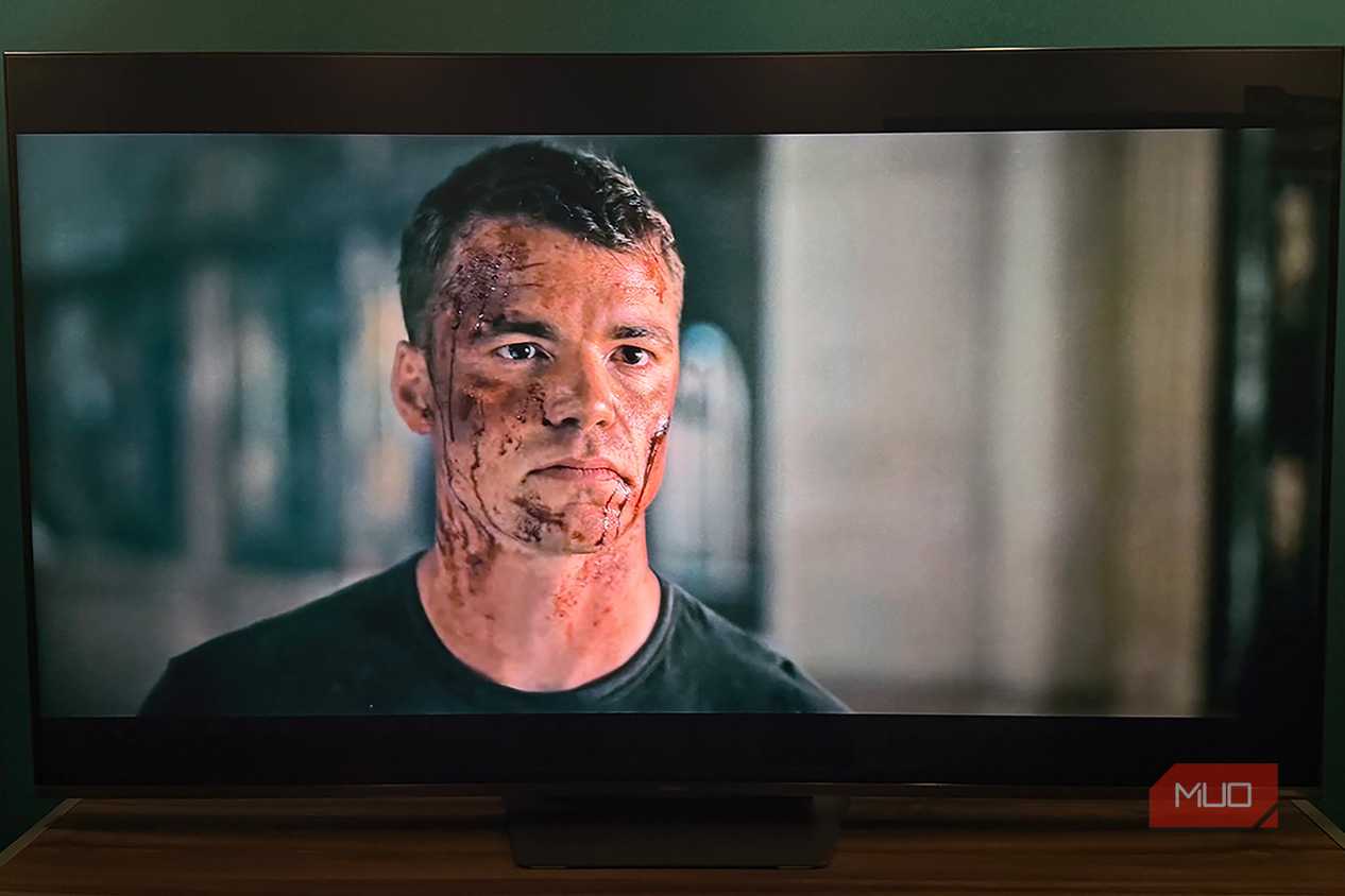 A bloody Peter in a scene from The Night Agent playing on a Hisense TV.