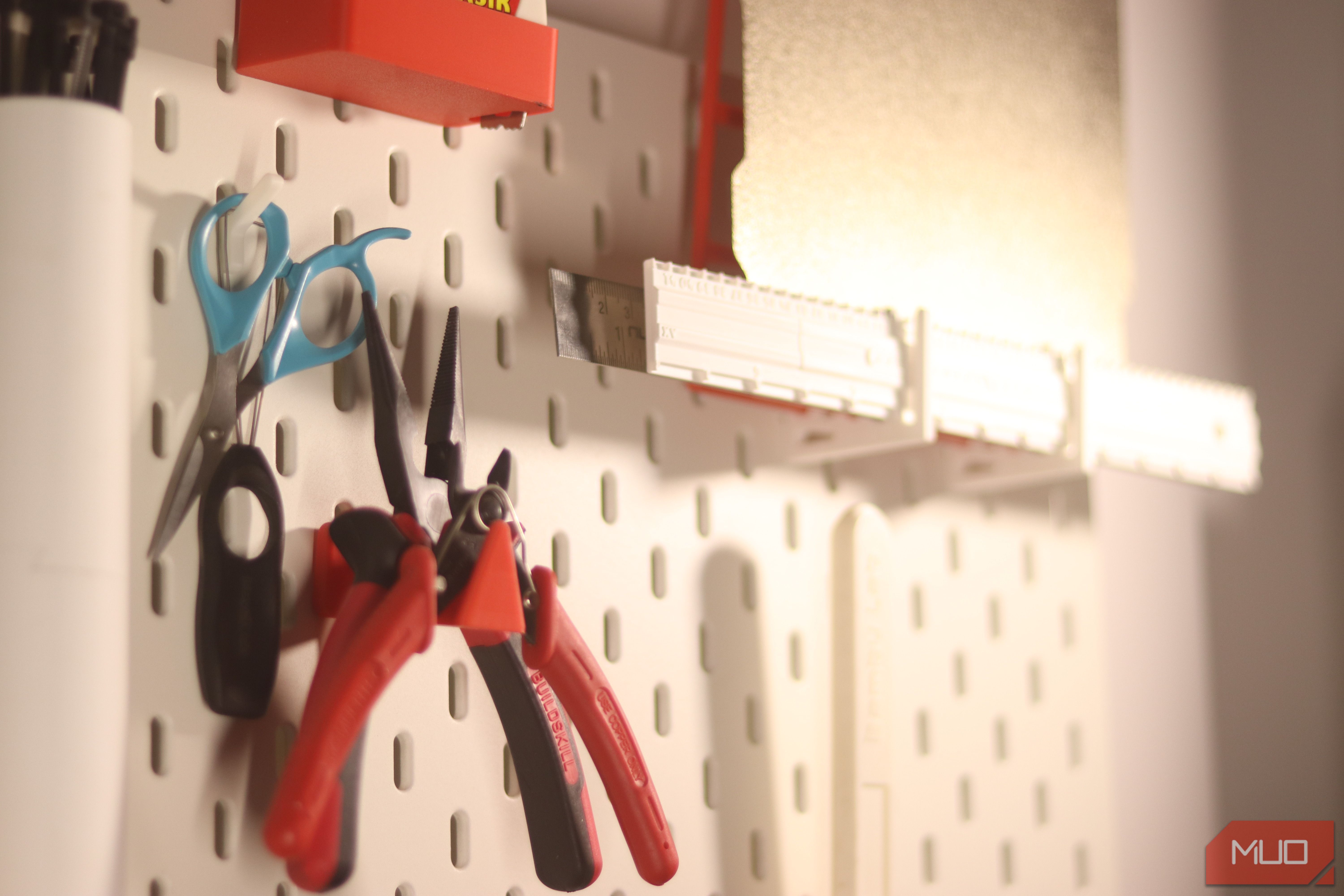 Ikea skadis with 3D printed plier holder.