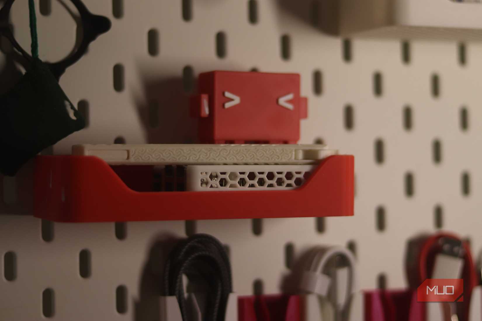 Ikea skadis with 3d printed tray and Claude Code logo.