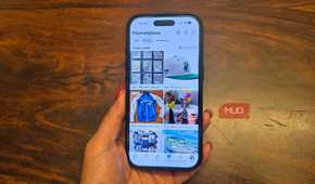 An iPhone in hand showing listings on Facebook Marketplace.