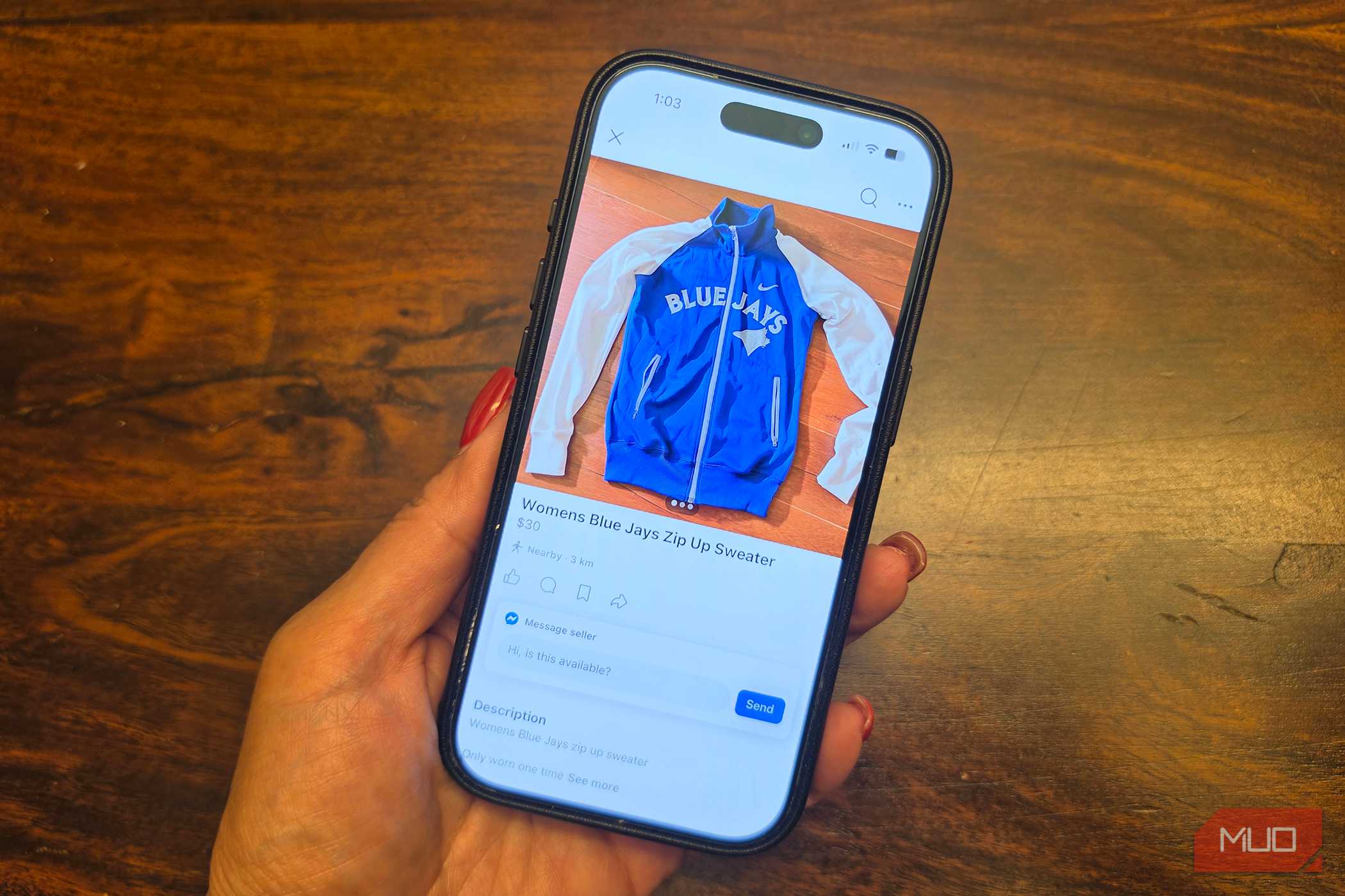 An iPhone in hand showing a listing on Facebook Marketplace.