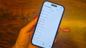 An iPhone in hand showing categories of items on Facebook Marketplace.