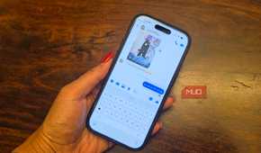 An iPhone in hand showing a Facebook Messenger conversation.